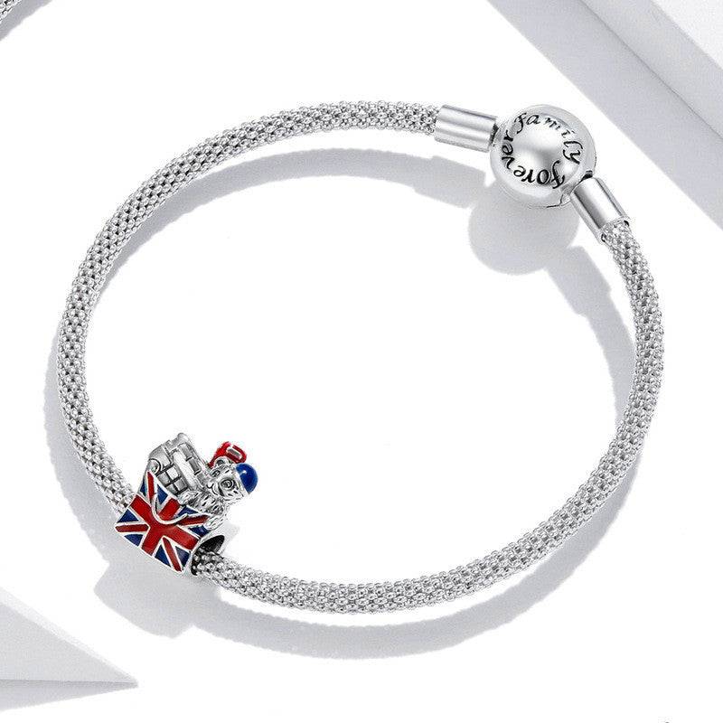 Sterling silver bracelet with London Charm showcasing UK landmarks and Union Jack, ideal for travel lovers and charm collectors.