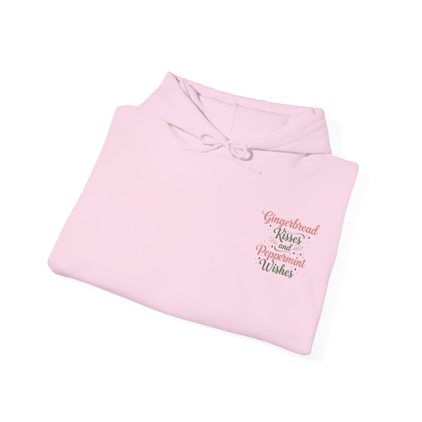 Folded pink Women’s Gingerbread Kisses Hoodie with festive front text, perfect for casual wear or as a thoughtful gift for her.