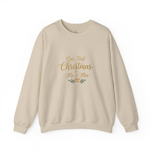 His/Hers Newlyweds Sweatshirt with 'Our First Christmas as Mr. & Mrs.' text in gold script, ideal holiday apparel for couples. Cozy unisex crewneck in beige.