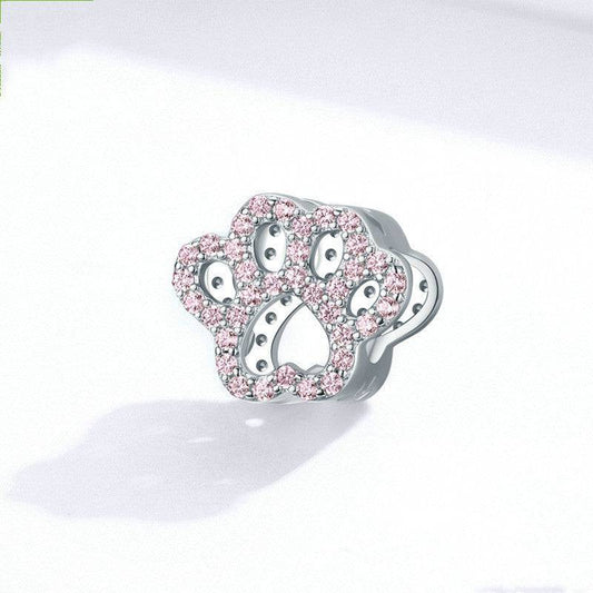 Adorable Pink Paw Charm for Bracelets shown on a white background, featuring sparkling pink stones for animal lovers.