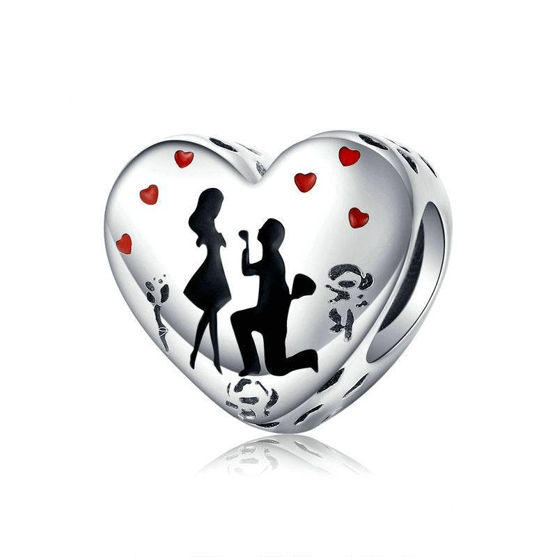 Elegant Engagement Charm for Bracelets featuring a heart-shaped design with a proposal silhouette and red heart accents, perfect for symbolizing love.