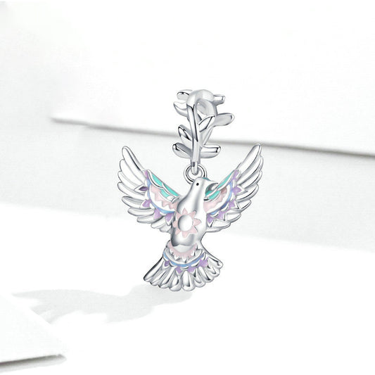 Elegant Dove Charm with soft pink and teal accents, crafted to express unique style and love for nature in fine jewelry.