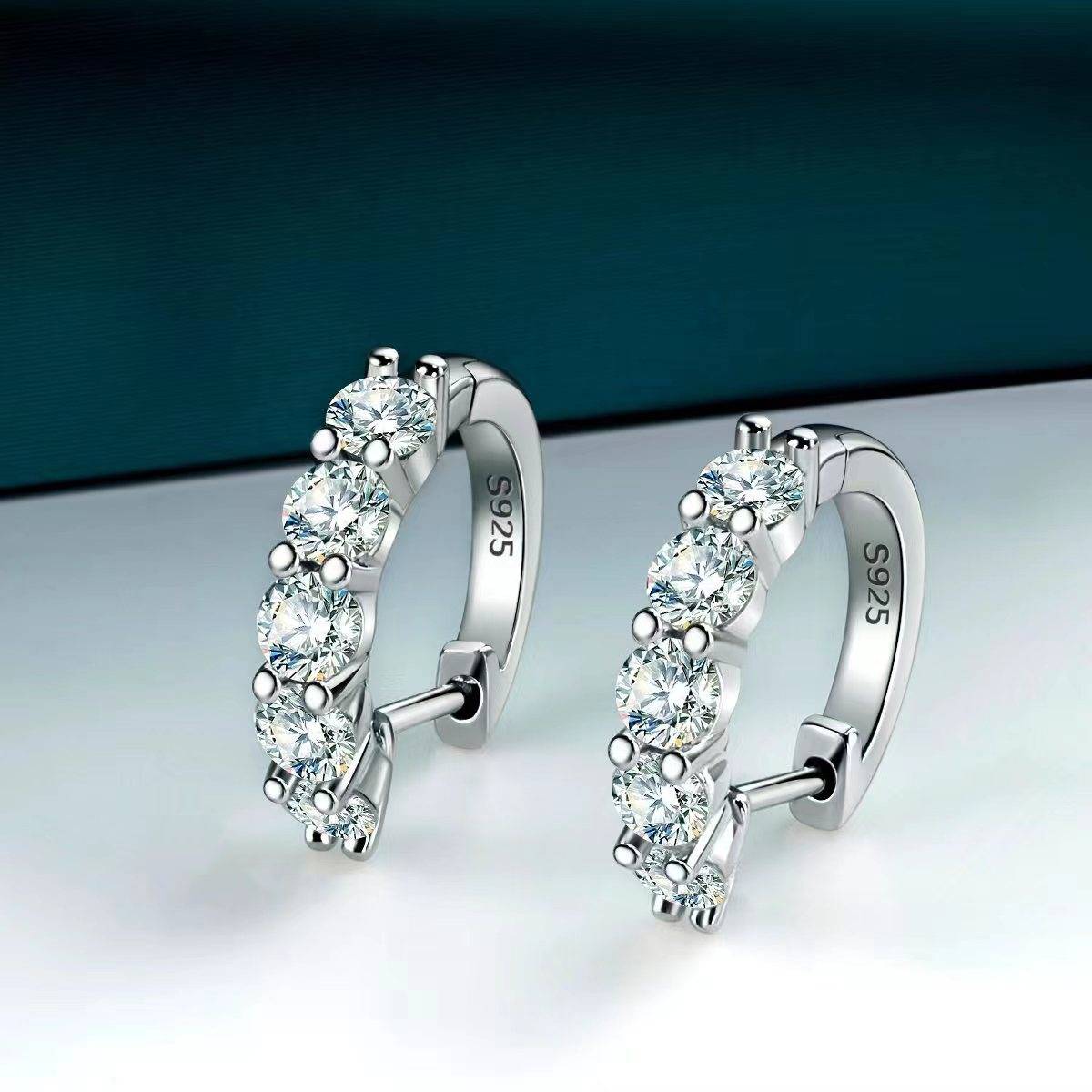 Moissanite Earrings - Sparkle Hoop Design showcasing brilliant white moissanite stones in sterling silver. Elegant and timeless style.