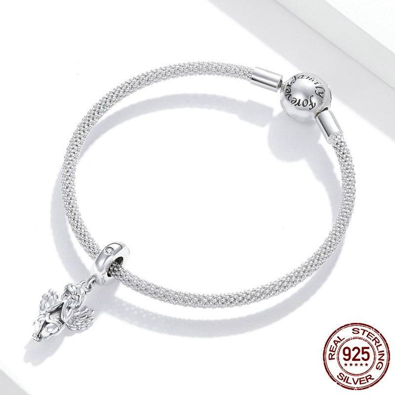 Little Angel Charm on a textured sterling silver bracelet. A divine accessory symbolizing serenity and grace for all ages.