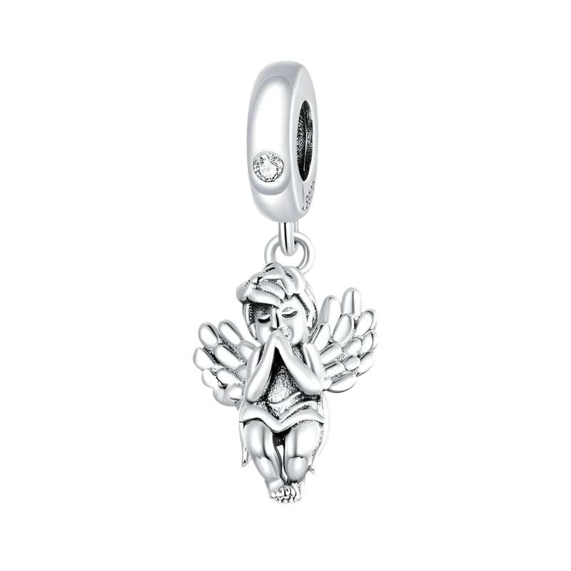 Little Angel Charm in sterling silver featuring a praying angel with detailed wings. A graceful jewelry pendant for spiritual elegance.