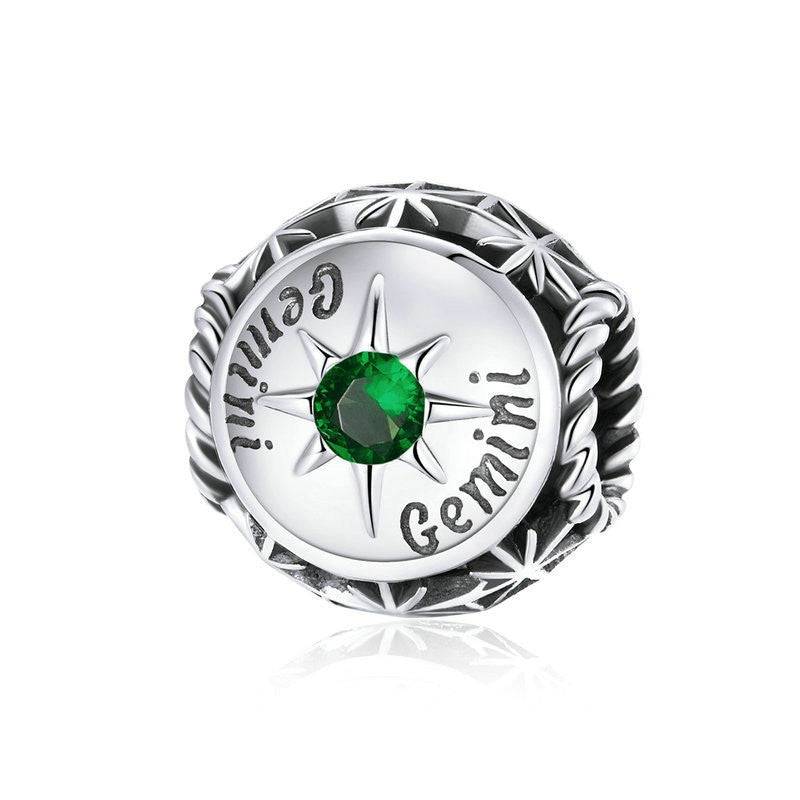 Gemini Horoscope Charm showcasing green zircon in a star motif. Astrology-themed jewelry from Celestial Styles collection.