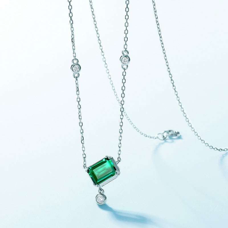 Full view of Emerald Necklace - Rectangular Design with 6x8mm emerald pendant and diamond-accented silver chain layout.