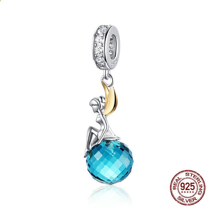 Handcrafted Blue Crystal Fairy Charm featuring a dazzling blue gemstone and sterling silver fairy with gold-tone wings, perfect for charm bracelets.