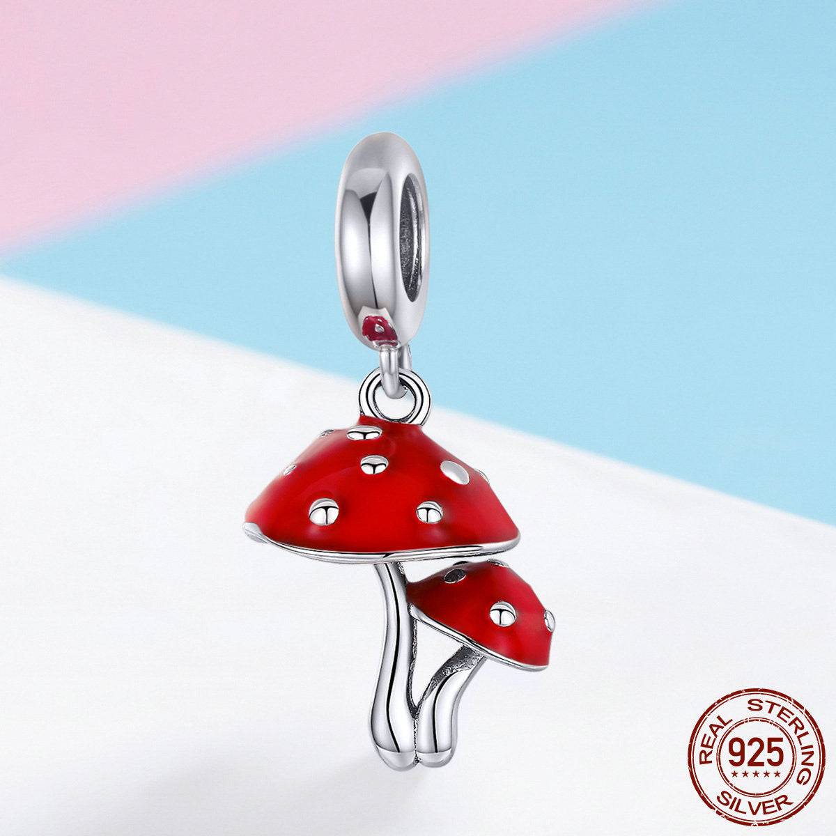 Close-up of red enamel Mushroom Charm with 925 sterling silver stamp, showcasing its high-quality craftsmanship and playful design.