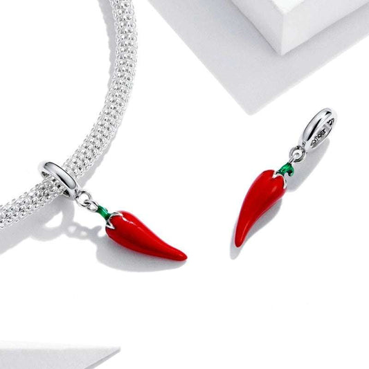 Red chili pepper-shaped earrings with silver hooks on a white background, featuring 'Real 925 Sterling Silver' stamp.