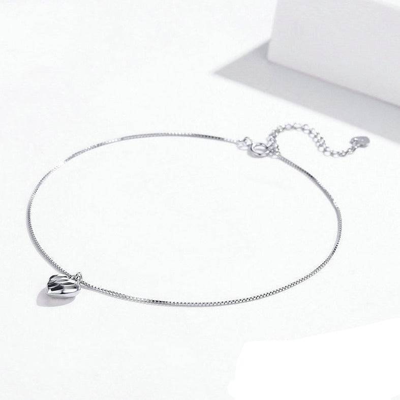 Charming Dangle Heart Anklet with polished heart pendant and adjustable chain. Great for gifting or accessorizing with love-inspired fashion.