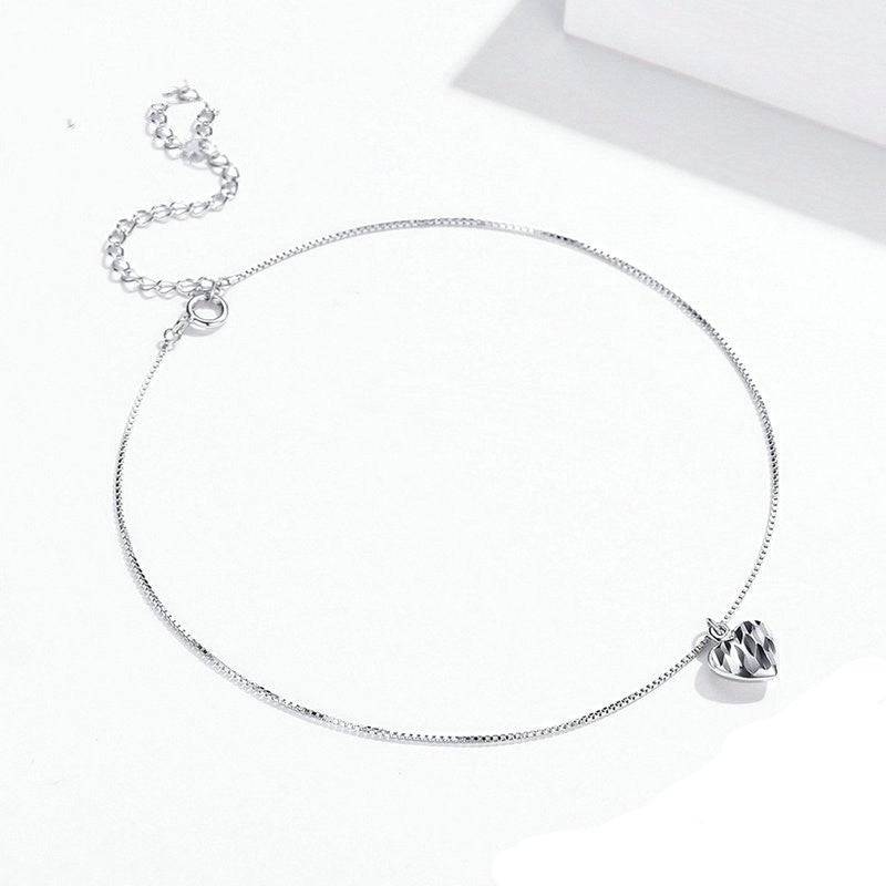Charming Dangle Heart Anklet featuring a faceted heart charm and fine silver chain. A must-have in jewelry collections for romantic style.