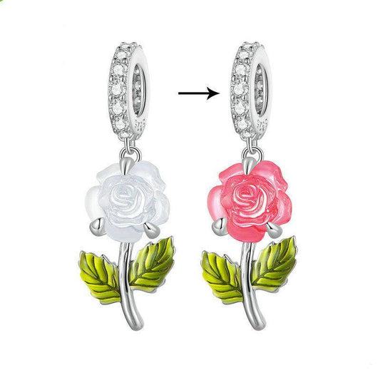 Colour Changing Rose Charm shifts from white to pink with temperature, featuring green leaves and crystal-studded loop for bracelets.