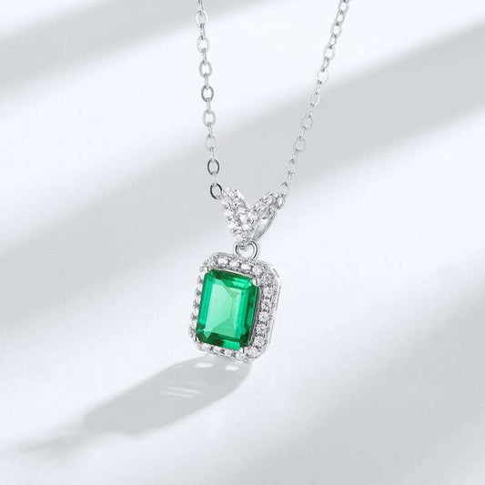 Elegant Drop Emerald Necklace featuring a vivid green cultivated emerald set in 925 silver with a diamond-accented pendant bail.