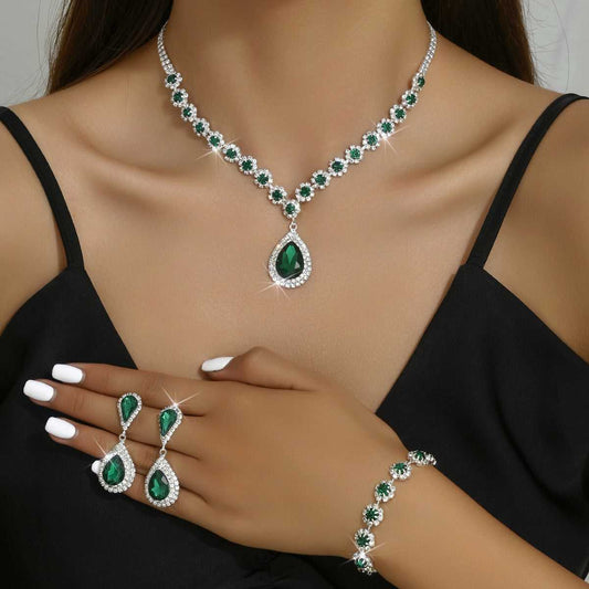 Model wearing green Three-piece Jewellery Set - Complete Set | Elegant Trio with teardrop pendant necklace, matching earrings, and bracelet.