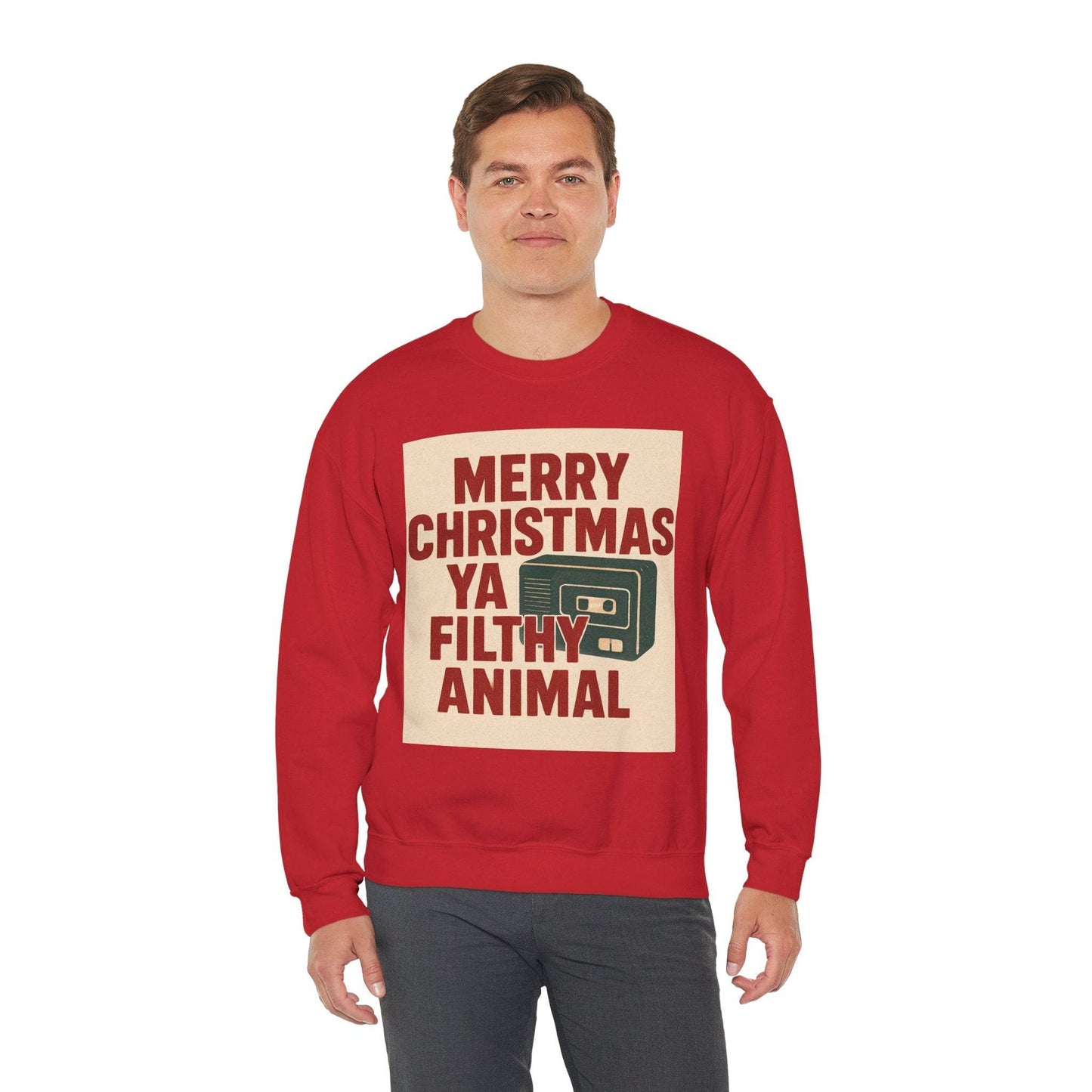 Unisex Christmas Sweatshirt - Home Alone Inspired in red with 'Merry Christmas Ya Filthy Animal' text and cassette graphic, ideal for festive winter wear. Cozy and eco-friendly holiday apparel perfect for parties or lounging.