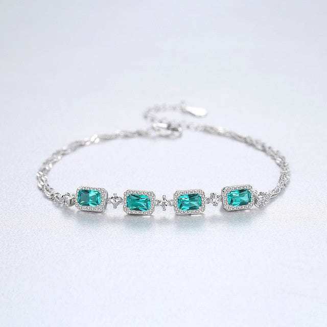 Baguette Cut Emerald Bracelet featuring vibrant green emeralds in a silver setting, perfect for jewelry lovers seeking refined accessories.