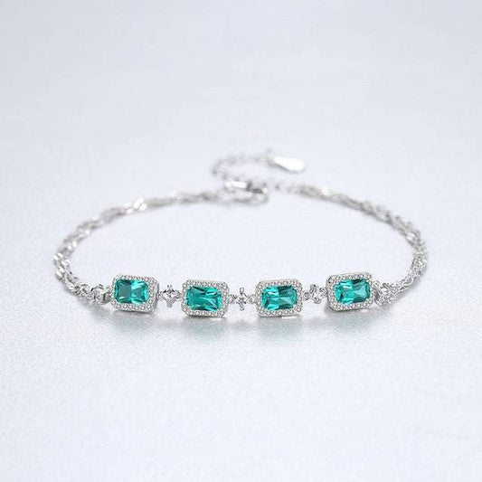 Baguette Cut Emerald Bracelet featuring vibrant green emeralds in a silver setting, perfect for jewelry lovers seeking refined accessories.