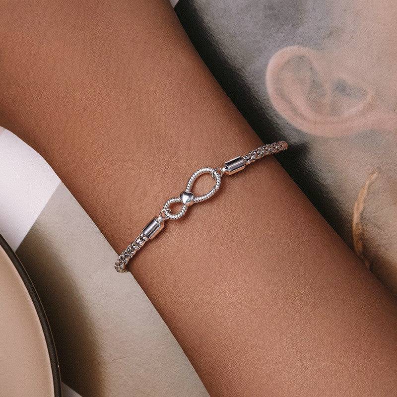 Infinity Knot Silver Bracelet worn on wrist, highlighting its elegant design and symbolic infinity charm for everyday or special occasion wear.