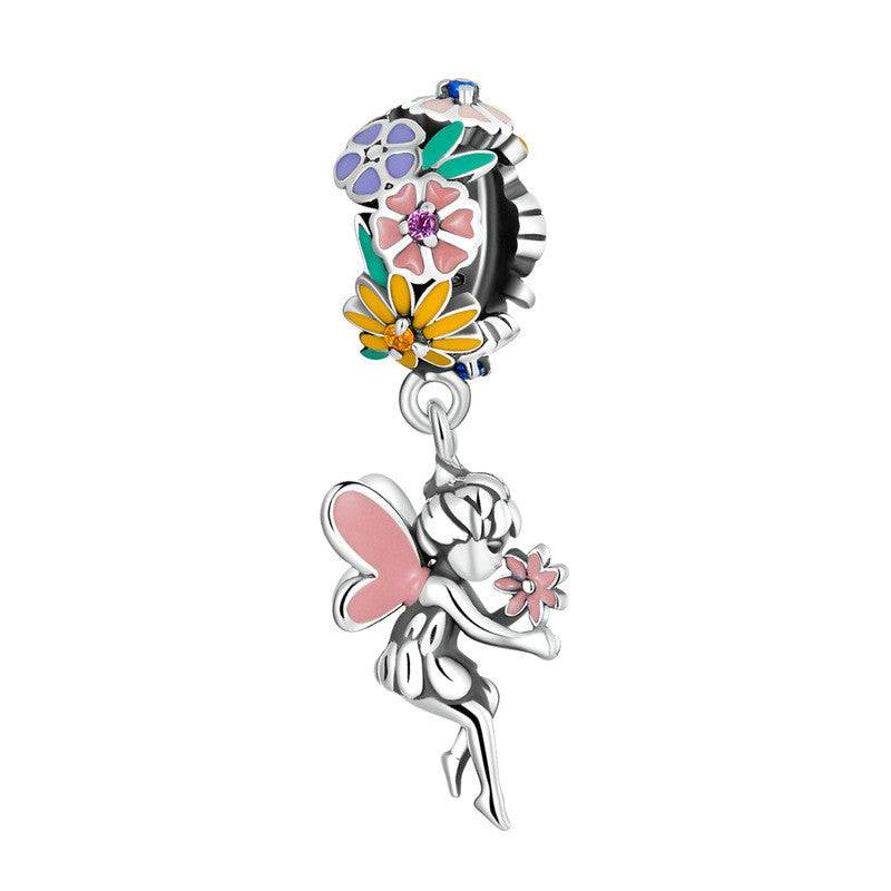 Fairy-themed Colourful Charms dangle charm with floral enamel and pink wings. Add whimsical color to your jewelry collection.