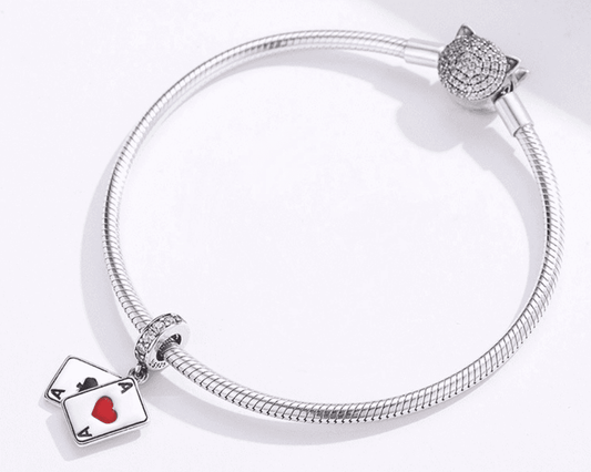 Unique Playing Cards Charm on silver bracelet, showcasing ace of hearts and spades, perfect for card lovers and jewelry collectors.