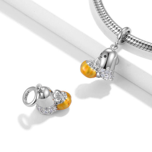 Ghost Charm - Spooky Jewelry shown on a silver bracelet and separately, highlighting its ghost and pumpkin design with sparkling crystal accents.