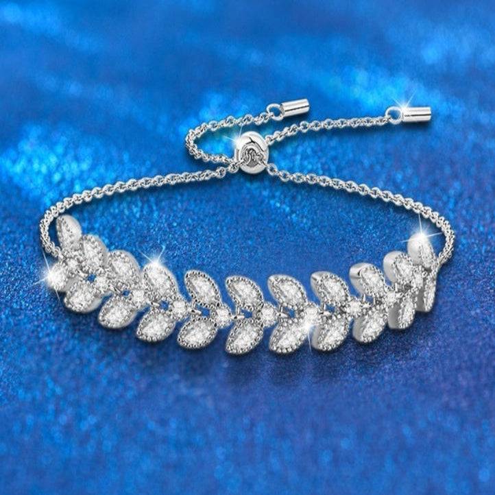 Moissanite Petal Bracelet - Silver Wheat Moissanite design with adjustable sterling silver chain and sparkling leaf-shaped stones on blue background.