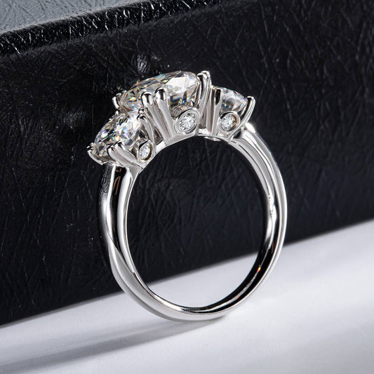 Side view of Trio Moissanite Ring showcasing intricate sterling silver setting with three brilliant moissanite stones. Elegant and timeless design.