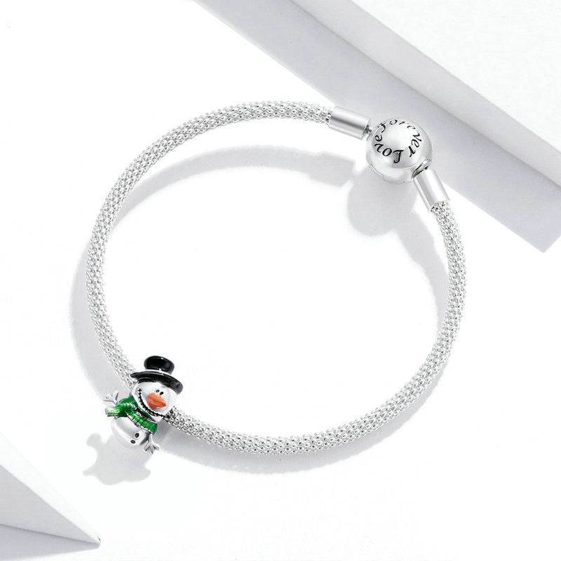 Silver bracelet featuring a snowman charm with a festive winter theme.