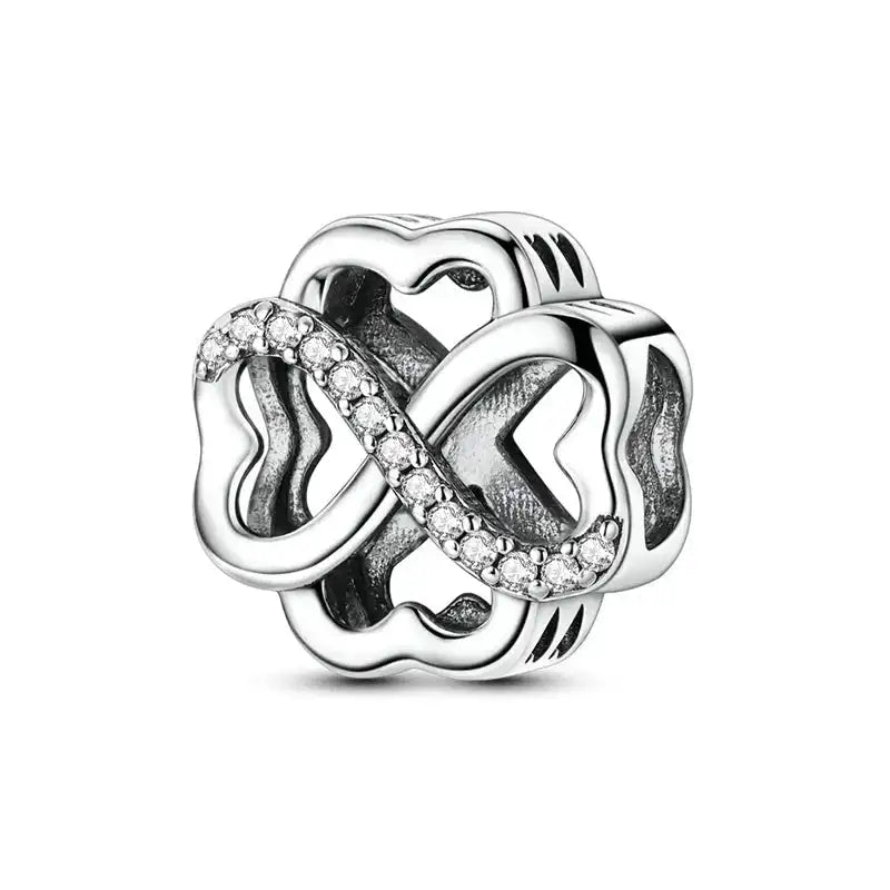 Beaded Charm - Four Leaf Clover Charm in sterling silver with infinity symbol and cubic zirconia, symbolizing luck and prosperity.