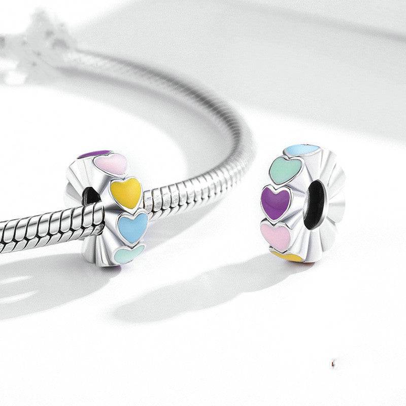 Vibrant Rainbow Heart Spacer charm featuring multicoloured enamel hearts on a silver base, perfect for bracelets in the jewelry category.