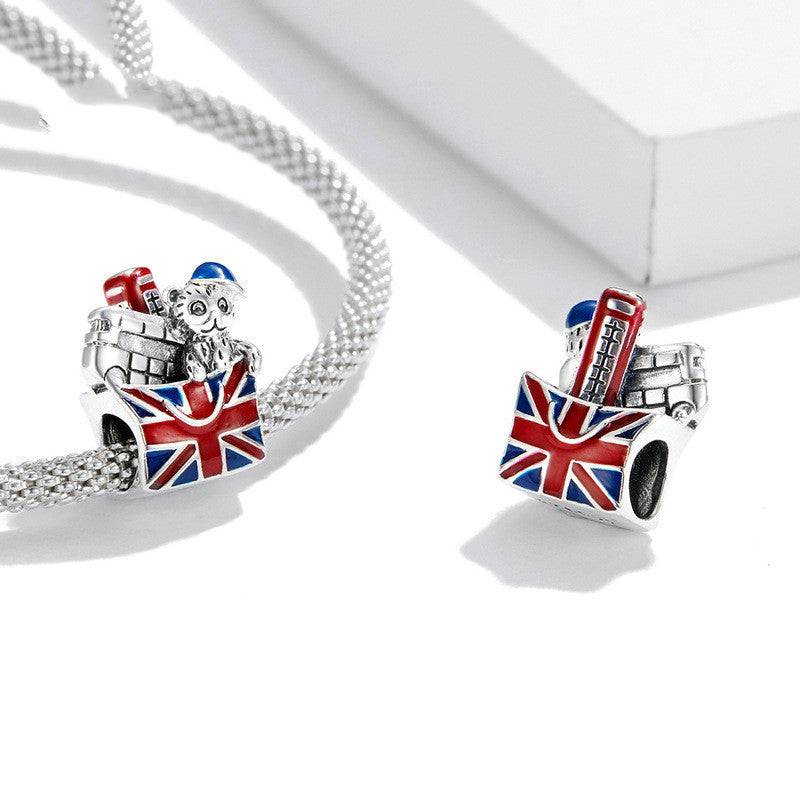 Set of London-themed sterling silver charms with Union Jack design, perfect for travel-inspired bracelets and UK souvenir jewelry collections.
