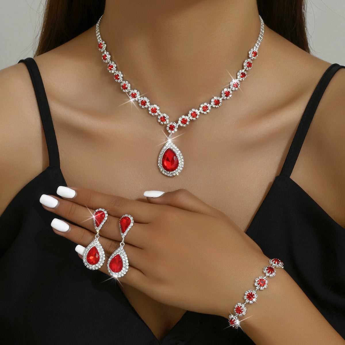 Red Three-piece Jewellery Set - Complete Set | Elegant Trio with teardrop pendant necklace, earrings, and floral bracelet for formal occasions.