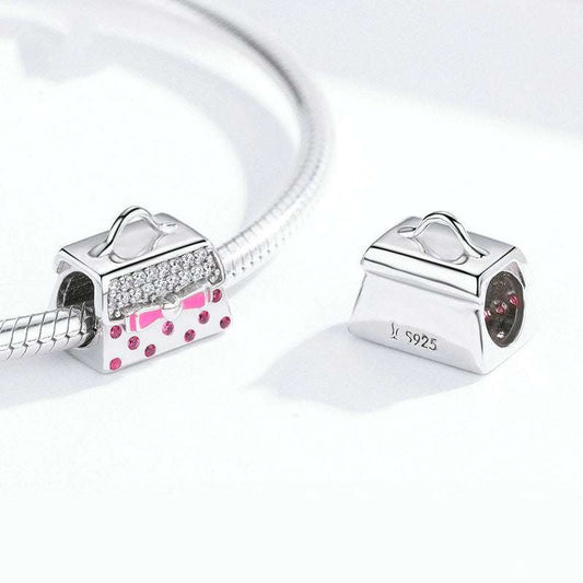 Pink Handbag Charm on silver bracelet, showcasing its detailed pink bow and crystal accents for stylish accessory customization.