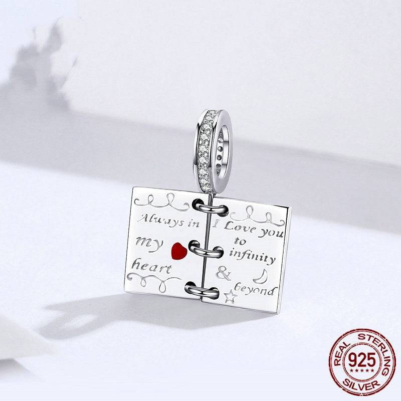 Close-up of Romantic Love Notes Charm for Bracelets with engraved love message and red heart, made from 925 sterling silver for lasting beauty.