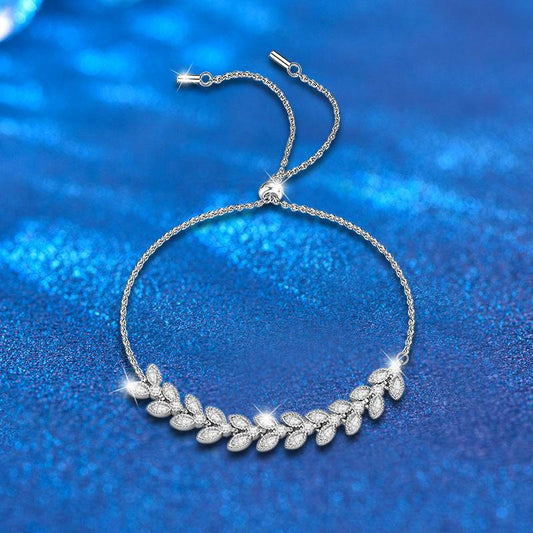 Moissanite Petal Bracelet - Silver Wheat Moissanite design with adjustable sterling silver chain and sparkling petal-shaped stones on blue background.