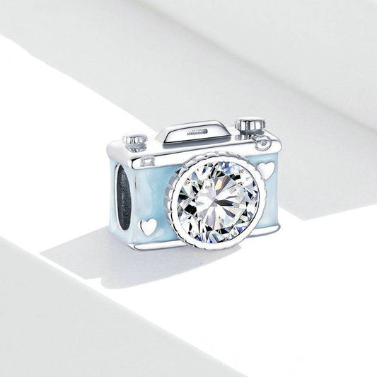 Camera charm with crystal on white background