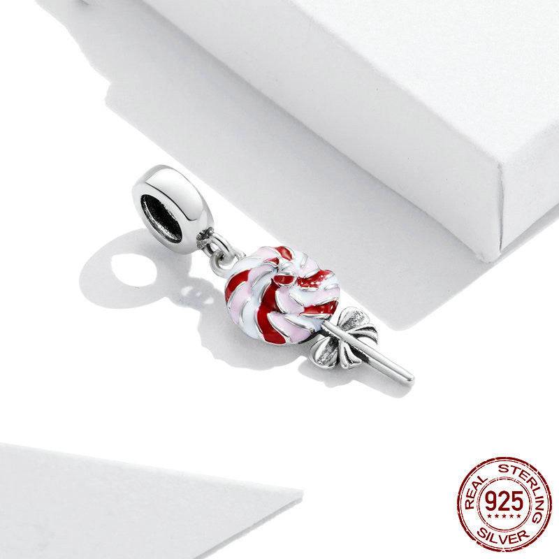 Close-up of Lollipop Charm for Bracelets with red and white swirl and silver bow, crafted in 925 sterling silver.