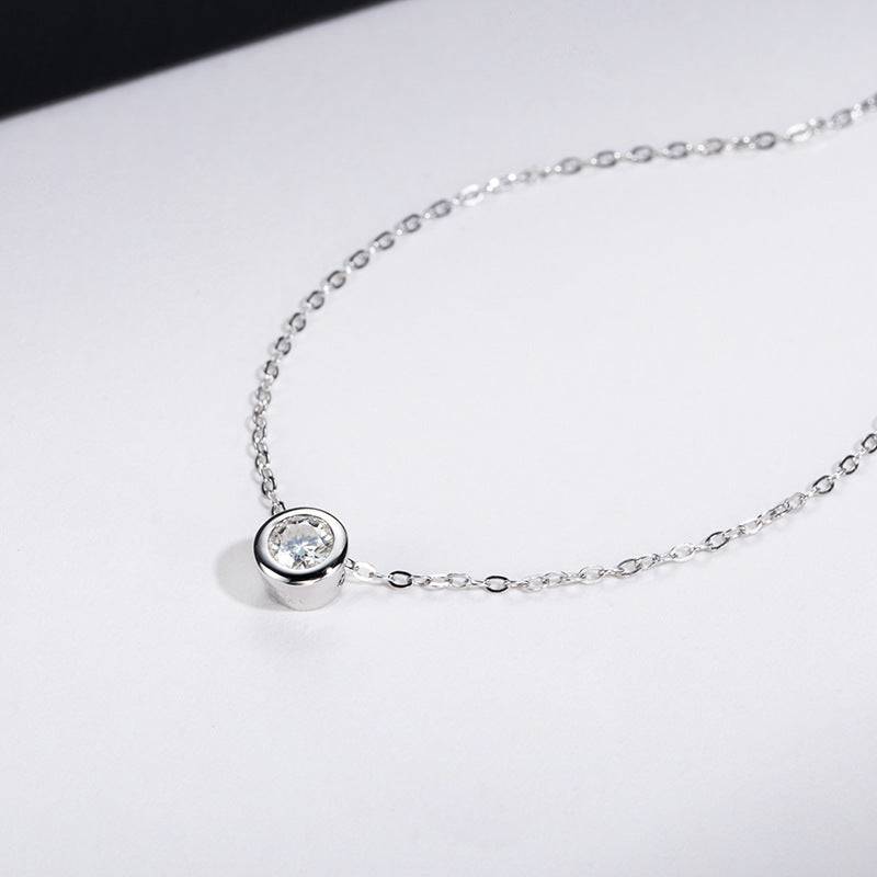 Side view of Classic Moissanite Necklace with 4.0MM pendant on a fine silver chain. A chic addition to modern jewelry collections.