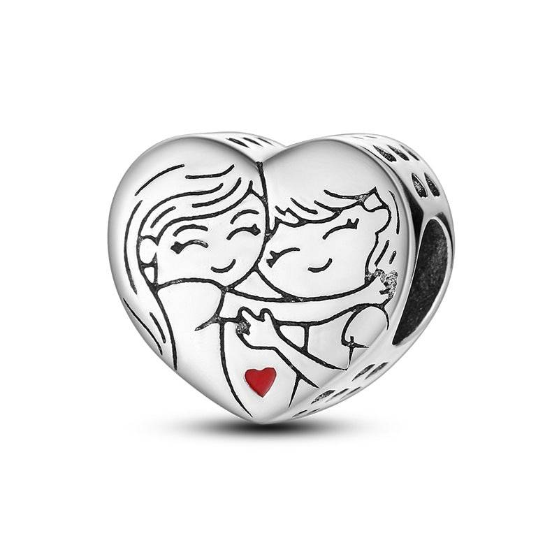 Heart charm with engraved hugging couple and red heart accent. A romantic love charm perfect for bracelets symbolising deep emotional connection.