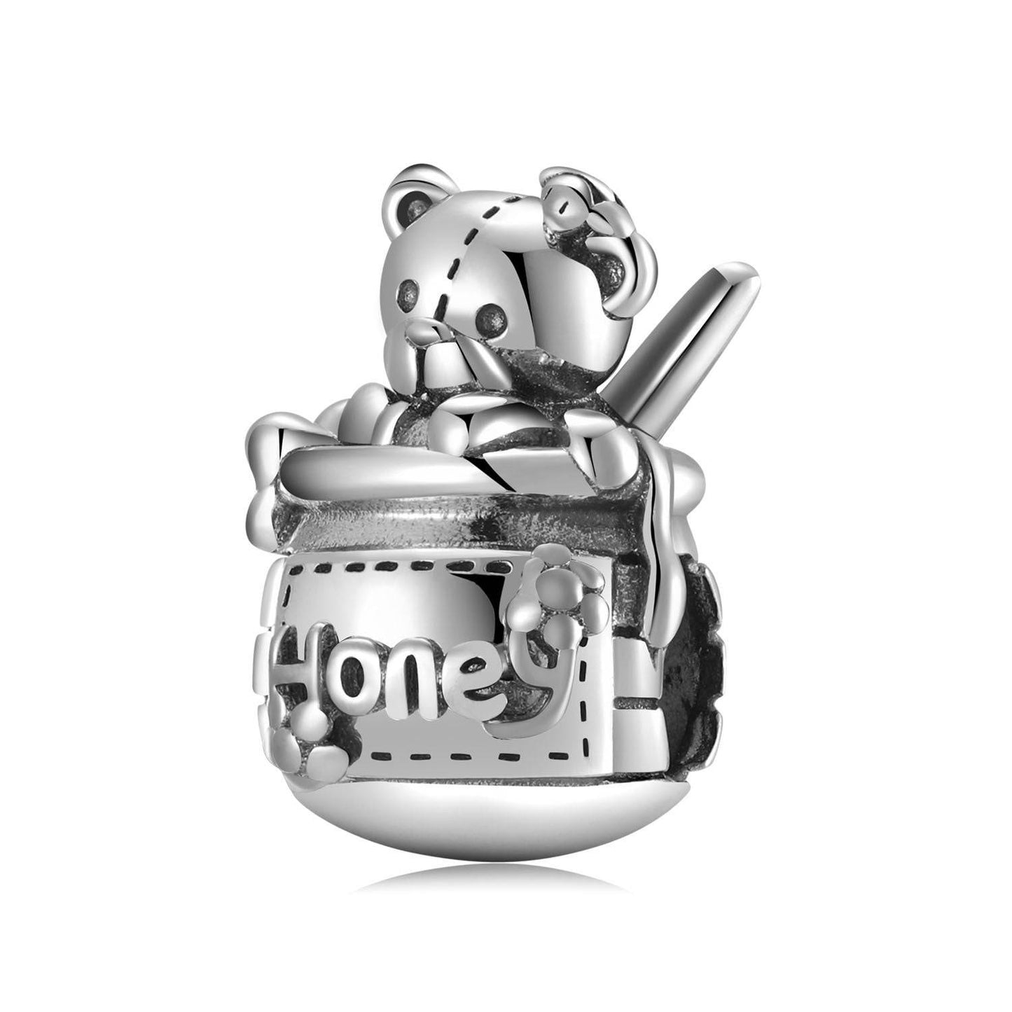 Honey Jar Charm in sterling silver featuring a teddy bear holding a honey pot with intricate detailing. A nostalgic jewelry piece for bracelets.