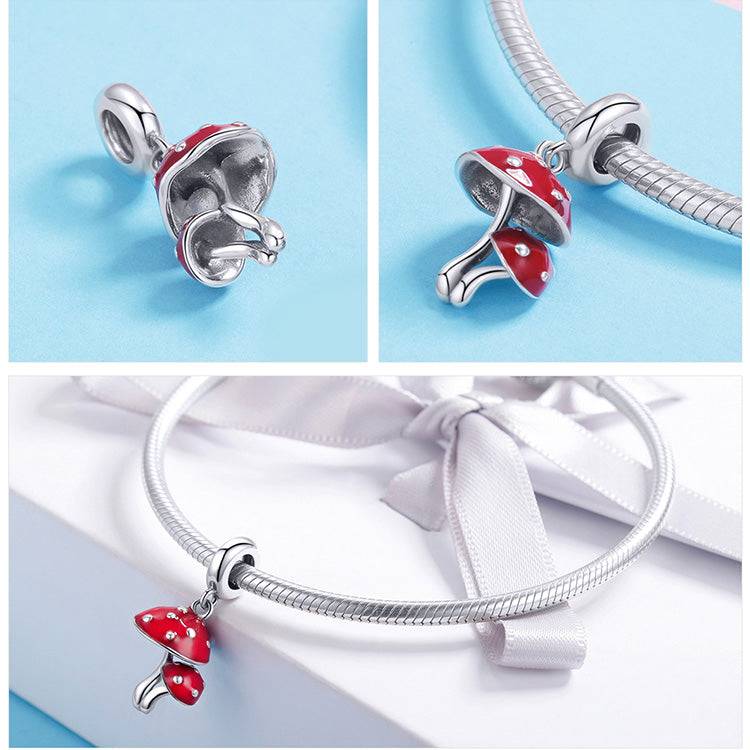 Whimsical red Mushroom Charm for bracelets displayed on a gift box and bracelet, crafted from real 925 sterling silver for lasting shine.