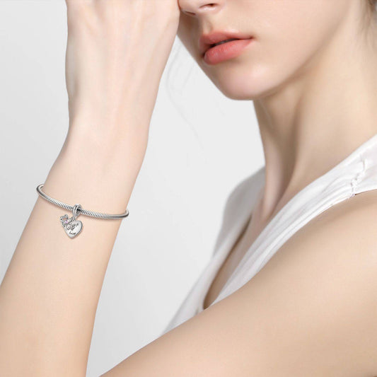 Model wearing the Gift of Love Charm for Bracelets, showcasing its elegant and romantic appeal as a meaningful jewelry accessory.