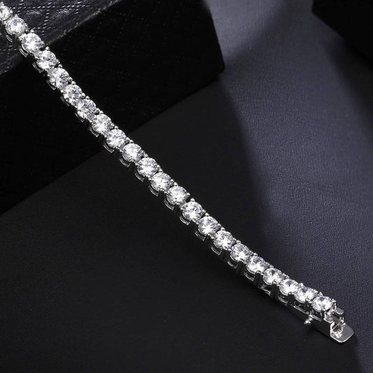 Close-up of Sparkling Tennis Bracelet on black background showcasing brilliant silver finish and shimmering cubic zirconia stones.