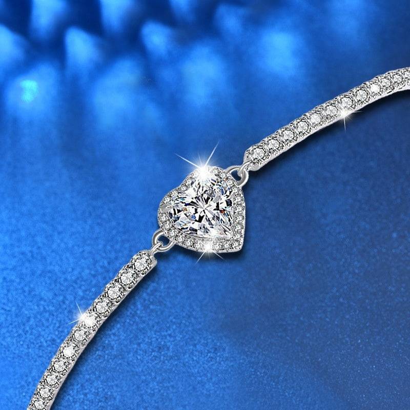 Close-up of Silver Moissanite Heart Bracelet highlighting the heart-shaped moissanite centerpiece and intricate silver detailing.