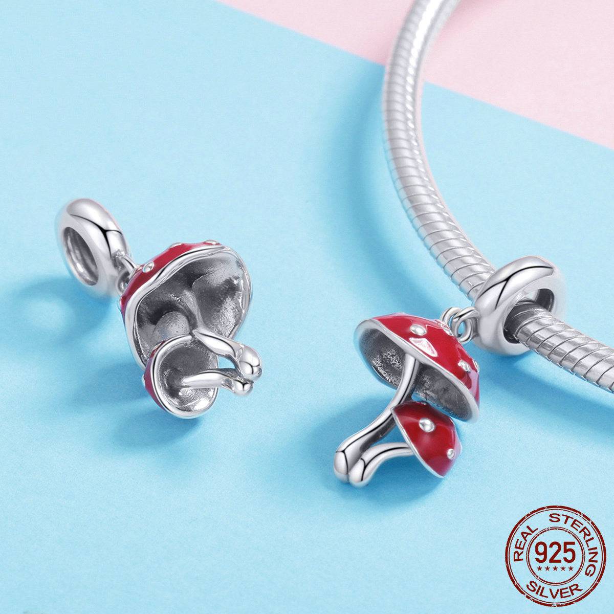 Nature-inspired Mushroom Charm in red enamel and 925 sterling silver, shown on a bracelet and separately to highlight design details.