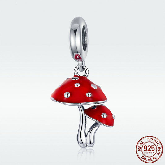 Sterling silver Mushroom Charm with red enamel detailing, ideal for bracelets and pendants in whimsical, nature-themed jewelry styles.