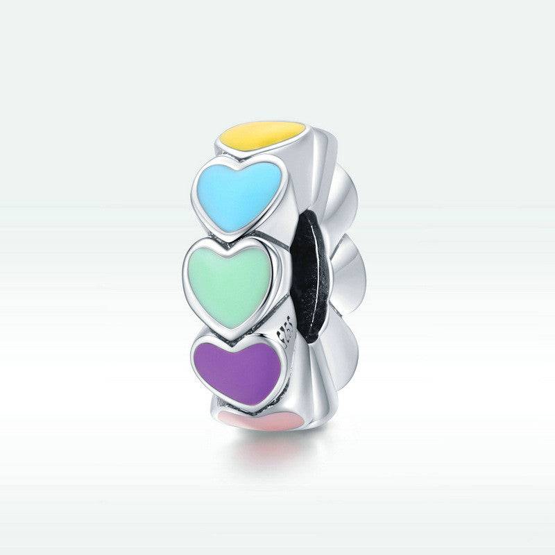 Vibrant Rainbow Heart Spacer charm featuring colorful enamel hearts on a silver base, perfect for adding love and color to your bracelet.