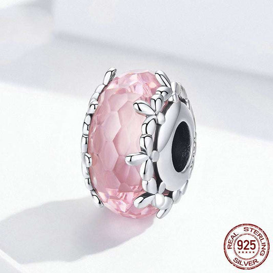 Pink Floral Bead - Delicate Feminine Charm featuring 925 sterling silver and intricate floral accents over a pink faceted surface.