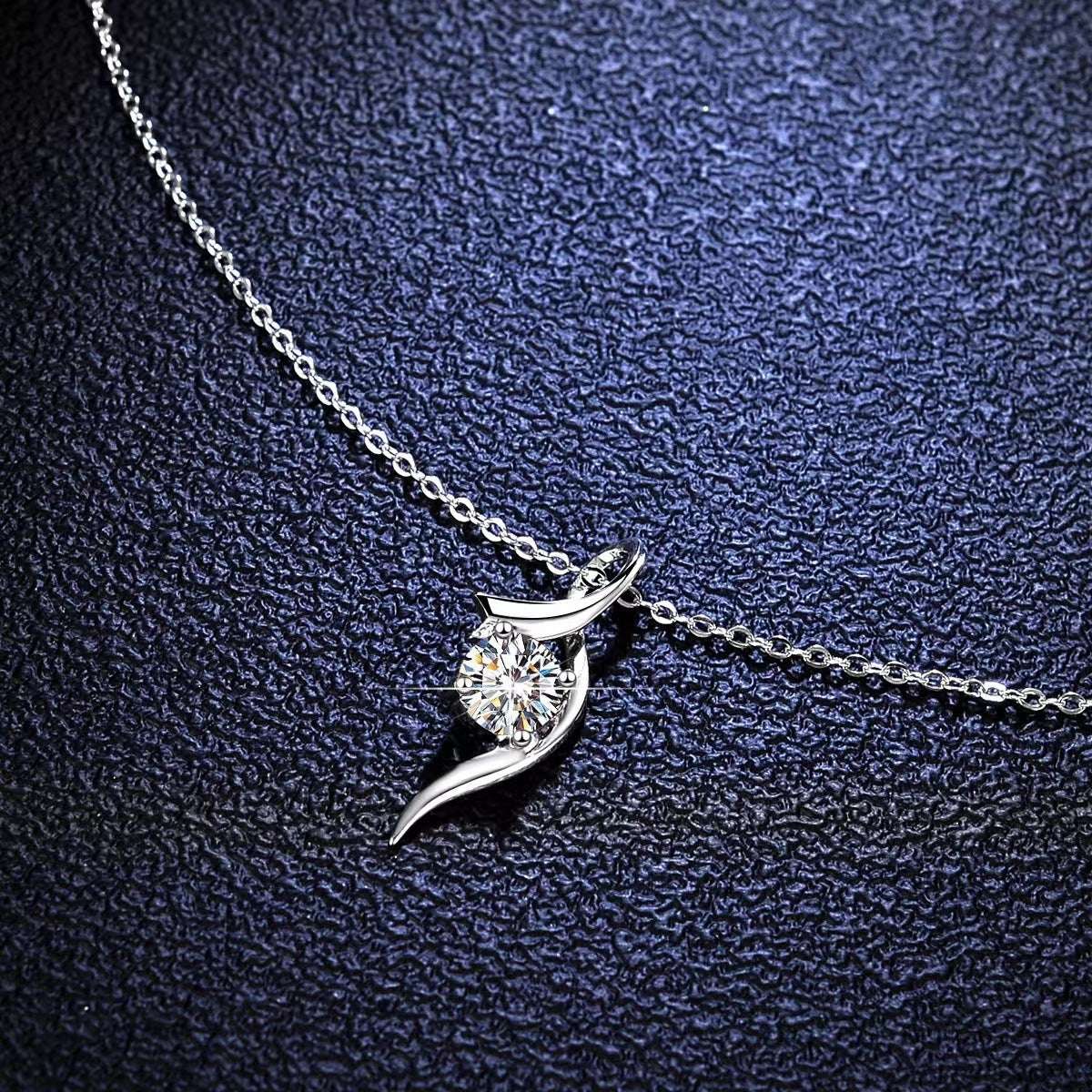 Minimalist 925 silver Elegant Moissanite Necklace with a brilliant 1ct moissanite stone, showcased on a textured dark background.